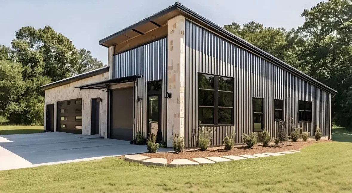 Modern farmhouse with metal siding, concrete tower, and finished driveway in Franklin
