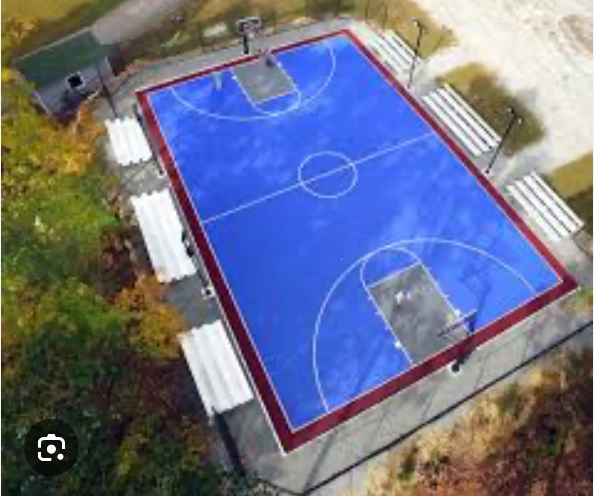 Aerial view of blue and red multi-sport court with soccer and basketball markings
